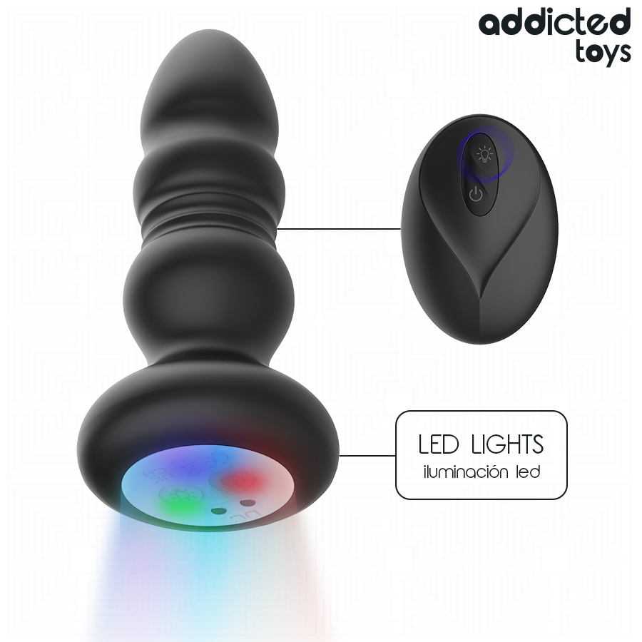 Base lumineuse LED du plug anal va-et-vient Addicted Toys en couleurs, vue de trois quarts